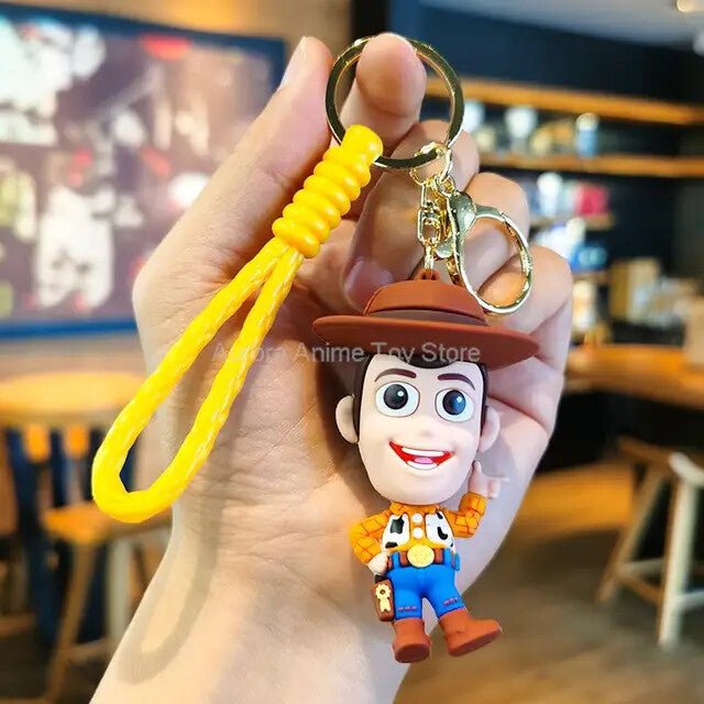 Woody 3D PVC keychain with yellow wristlet strap and gold-tone lobster clasp