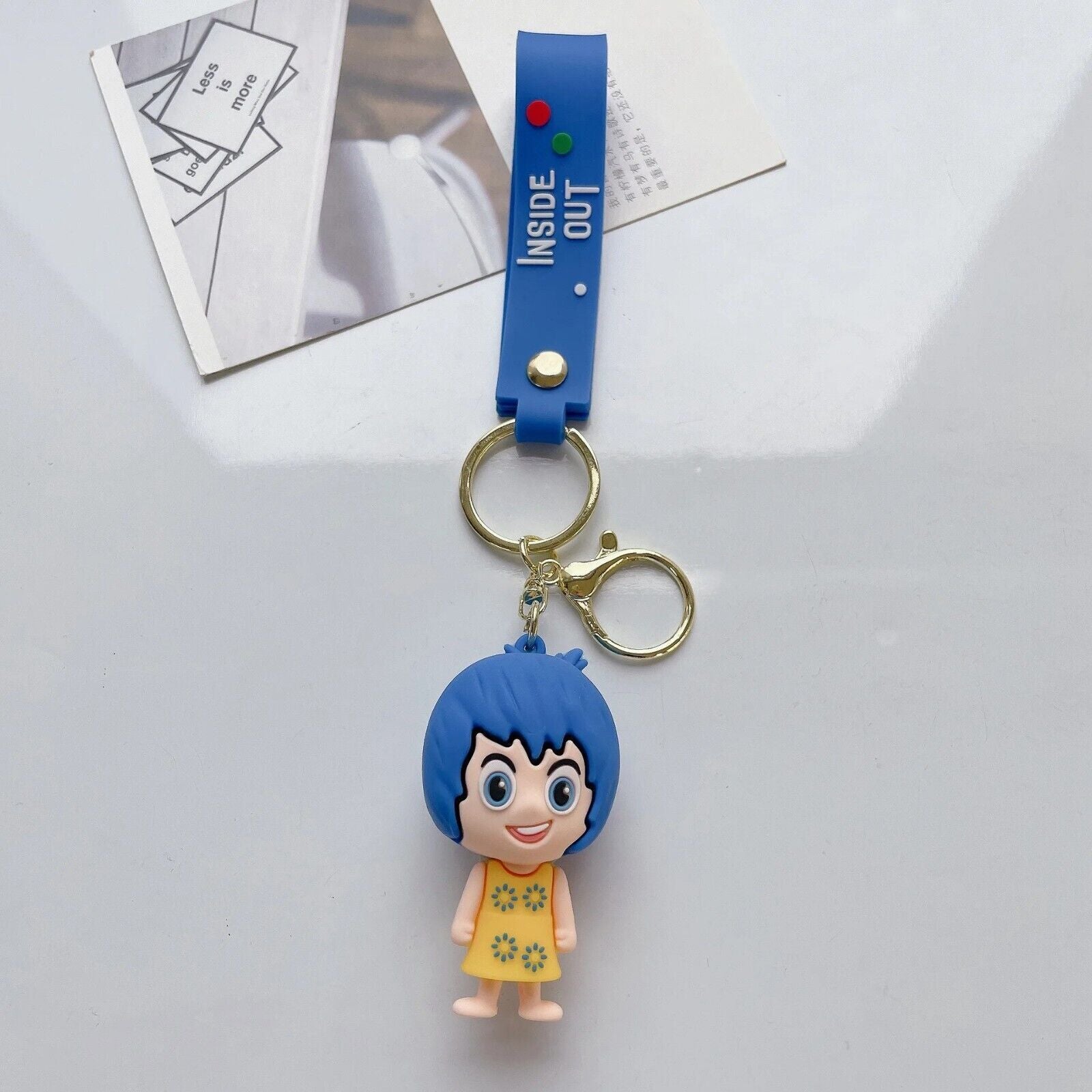 Joy Inside Out 3D PVC keychain with blue Inside Out wrist strap
