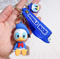 Donald Duck sitting 3D keychain with blue Donald Duck wristlet strap and mini face charm