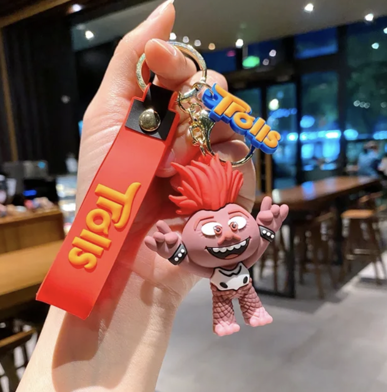 Pink Trolls character keychain with red silicone strap