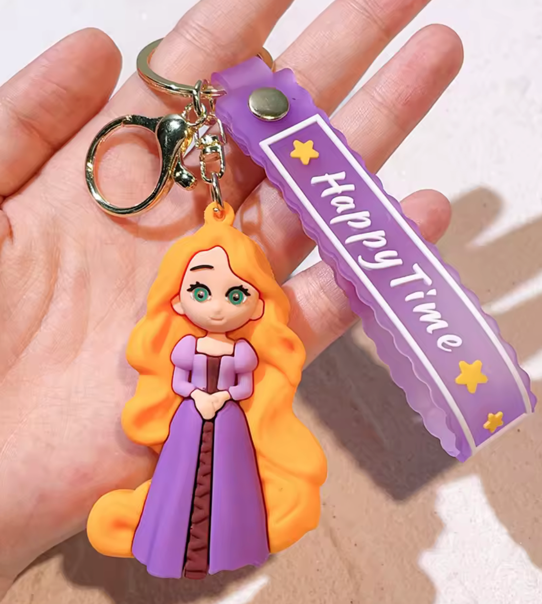 Rapunzel from Disney Tangled 3D PVC keychain with purple Happy Time wristlet strap and gold-tone lobster clasp