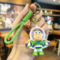 Toy Story Buzz Lightyear 3D PVC keychain held up showing full figure in space ranger suit