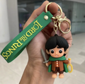 Lord of the Rings Frodo Baggins chibi keychain holding the One Ring and Sting with green wrist strap