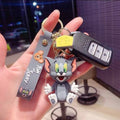 Tom Cat from Tom & Jerry 3D rubber keychain with grey Tom & Jerry wristlet strap, cheese charm and gold-tone lobster clasp